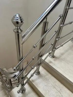 a stainless steel railing on a stairway at Dar l7aj Brahim in Marrakech