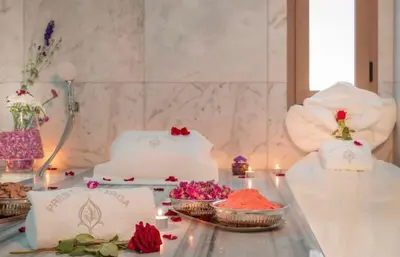 a table with a wedding cake and flowers on it at New and luxurious apartment with a pool in Marrakech