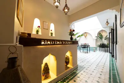 a building with a fireplace in the middle of a hallway at Riad Dar Yousra in Marrakech