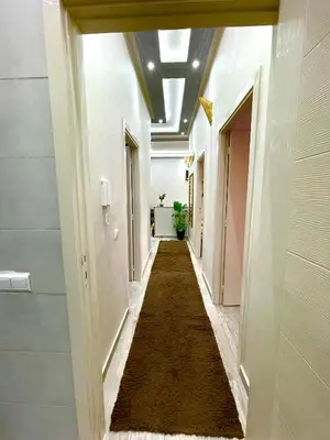 a hallway in a building with a long carpet at Mima in Marrakech