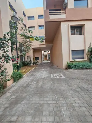 an empty street in front of a building at Studio Central Nour in Marrakech