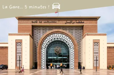 a large brick building with a large gate at Le COSY CHIC- NEUF - Modern & Chic - Terrasse et Confort - CLIM PARKING et WIFI Gratuit ! GUELIZ in Marrakech