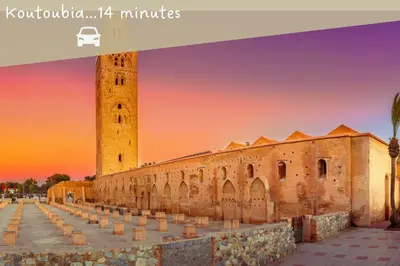 a view of a building with a clock tower at Le COSY CHIC- NEUF - Modern & Chic - Terrasse et Confort - CLIM PARKING et WIFI Gratuit ! GUELIZ in Marrakech