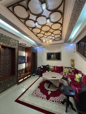 a living room with a couch and a table at Villa Saber in Marrakech