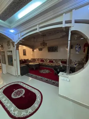 a living room with a couch and a rug at Villa Saber in Marrakech