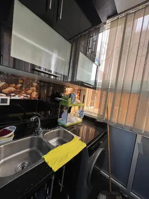 a kitchen with a sink and a counter top at Cozy apartment center Gueliz in Marrakech