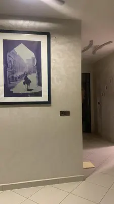a picture of a cow on a wall in a hallway at Villa Marrakech in Marrakech