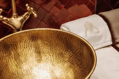 a sink in a bathroom with a towel next to a sink at Riad Beltza - 