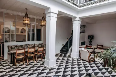 a lobby with a black and white checkered floor at Riad Beltza - 