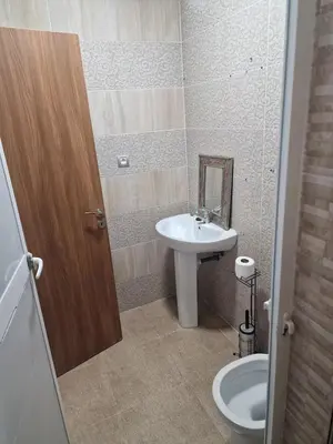 a bathroom with a sink and a toilet at Appartement à louer Marrakech tous les services in Marrakech