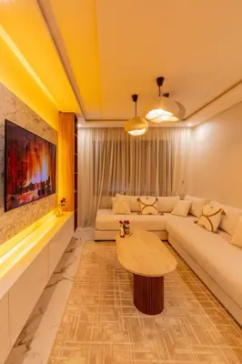 a living room with a couch and a table at Golden Palm Resort in Marrakech