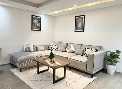 a living room with a couch and a table at Ruby in Marrakech