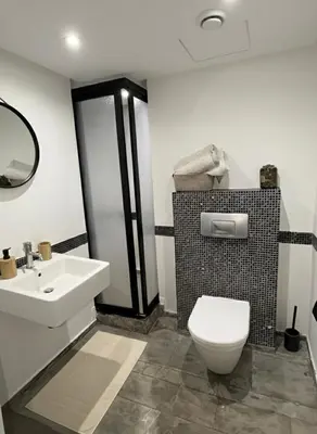 a bathroom with a white toilet and a sink at Ruby in Marrakech