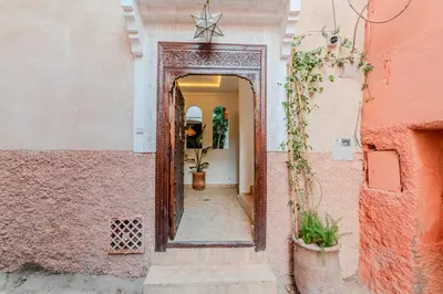 a hallway of a house with a star on the wall at Riad Dar Jamila Breakfast 10mn to Jamaa Al Fna in Marrakech
