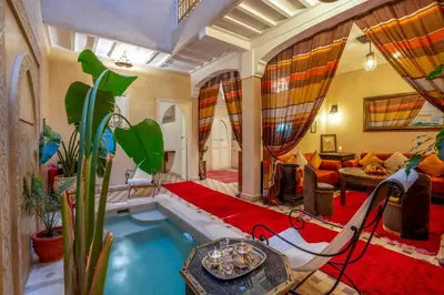 a large living room with a tub in the middle at Dar Flora in Marrakech