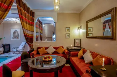 a living room with a couch and a table at Dar Flora in Marrakech