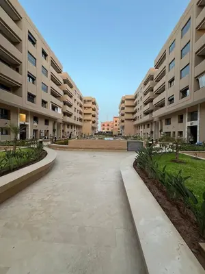 an empty courtyard in a large apartment building at Luxury Family Duplex in the Best Area of Marrakech with Pool and Garden in Marrakech
