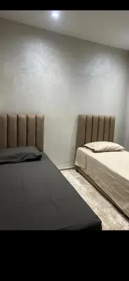 a bedroom with two beds in a room at Cozy appartment in Marrakech