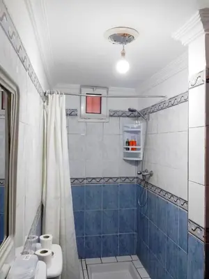 a bathroom with a shower and a toilet and a sink at APPARTEMENT DAR MARRAKECh G27 N7 in Marrakech