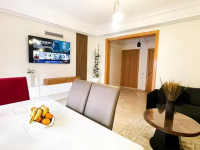 a living room with a table with fruit on it at appartement luxueuse in Marrakech