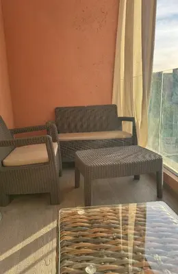 a rendering of a living room with furniture and a window at Welcome Home! in Marrakech
