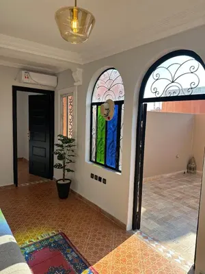 a room with two stained glass windows on the wall at Calm Oasis with Private Terrace in Marrakech
