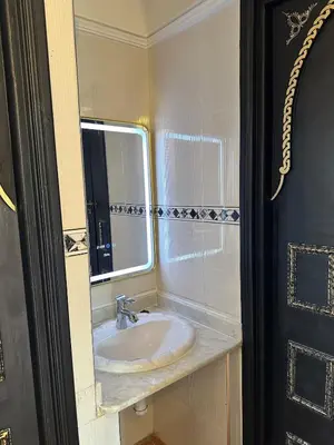 a bathroom with a sink and a mirror at Calm Oasis with Private Terrace in Marrakech