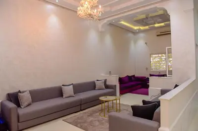 a living room with a couch and a table at Marrakech in Marrakech
