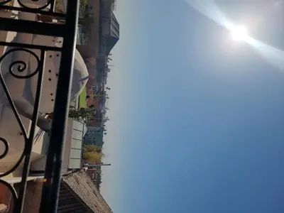 a view of a building with the sun in the sky at amazing home and amazing rooftop in Marrakech