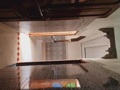 a glass table in a room with a ceiling at amazing home and amazing rooftop in Marrakech