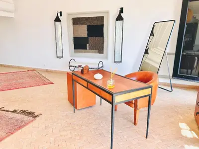 a room with a desk and a chair and a mirror at Villa Zaria Marrakech Heated Pool Family Friendly 25 Min To Medina in Marrakech