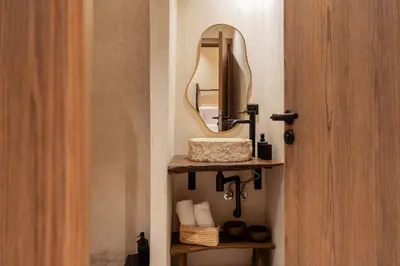 a bathroom with a sink and a mirror at Suite cosy en hypercentre in Marrakech
