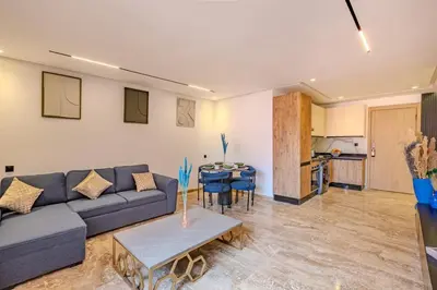 a living room with a couch and a table at Studio Ali gueliz in Marrakech