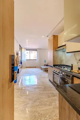 a kitchen with a stove and a counter top at Studio Ali gueliz in Marrakech