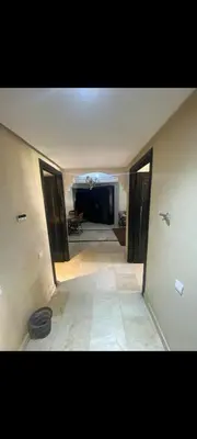 a hallway with a view of a living room at Riad jawhara in Marrakech