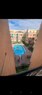 a view of a swimming pool in a building at Riad jawhara in Marrakech
