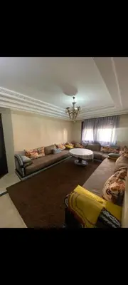a living room with two couches and a couch at Riad jawhara in Marrakech