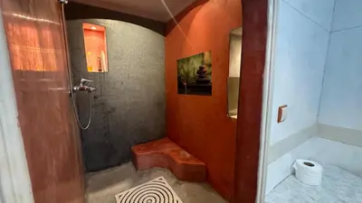 a bathroom with a shower and a toilet at Gueliz Boutique Apartment in Marrakech
