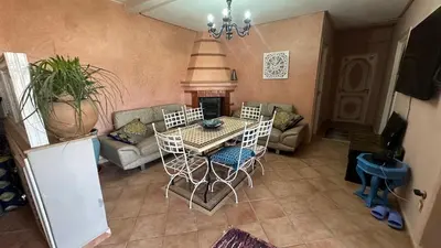 an aerial view of a living room with a table and chairs at Gueliz Boutique Apartment in Marrakech
