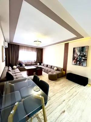 a living room with a couch and a table at L'Escapade Douce Marrakech in Marrakech