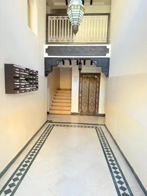 a hallway with a tile floor and a door at D13 Confortable A Riad Jawhara & Piscines in Marrakech