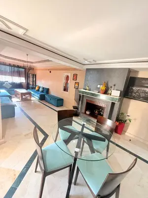 a living room with a glass table and a fireplace at D13 Confortable A Riad Jawhara & Piscines in Marrakech