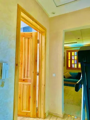 an open door to a room with a couch at المحاميد 10 in Marrakech