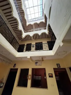 a building with a ceiling with a skylight at Riad dar Malak in Marrakech