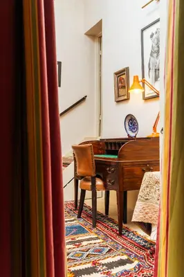 a living room with a piano and a desk at Riad Dar Dounia in Marrakech