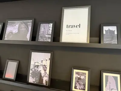 a shelf with pictures on it with at Majorelle Elegance City Center in Marrakech