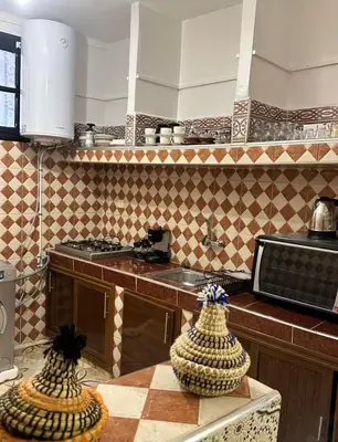 a kitchen with two vases sitting on a table at Apartment in heart of Medina in Marrakech