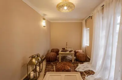 a room with a table and chairs and a window at Riad Privatif avec Personnel et Services Exclusifs - Kasbah Boma Marrakech I in Marrakech
