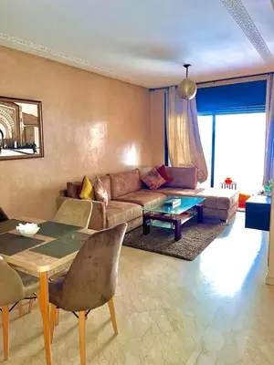 a living room with a couch and a table at Immob in Marrakech