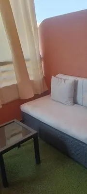 a small room with a couch and a table at Premium village c1866 in Marrakech
